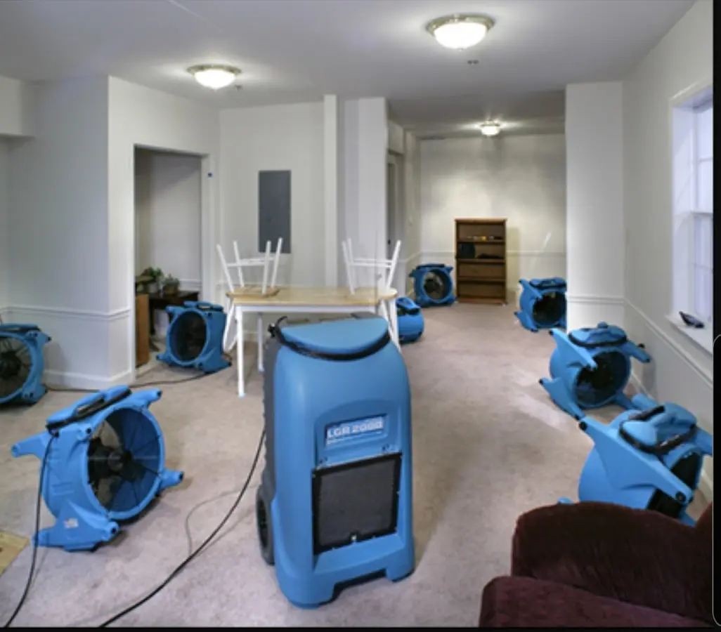Air movers and dehumidifier setup for Water Damage Restoration in Broussard